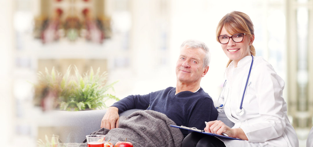 elderly and caregiver smiling